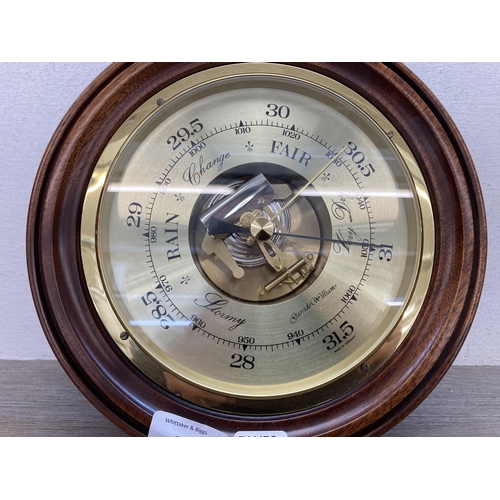 633 - A Garside Williams mahogany and brass aneroid barometer - approx. 23cm diameter