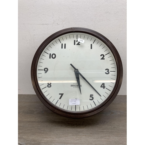 633B - A 1930s Bright's of London bakelite wall clock - approx. 37cm diameter