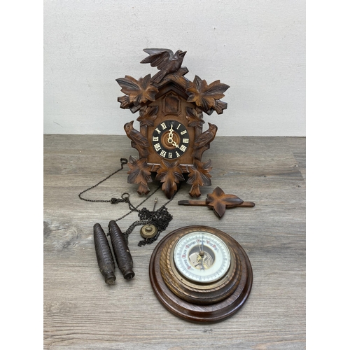 635 - Two items, vintage cuckoo clock with weights and oak cased aneroid barometer