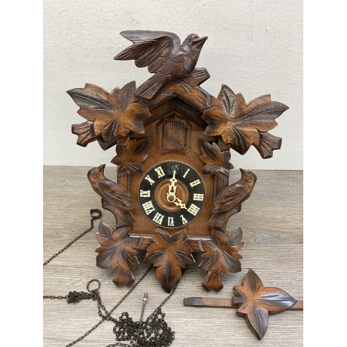 635 - Two items, vintage cuckoo clock with weights and oak cased aneroid barometer