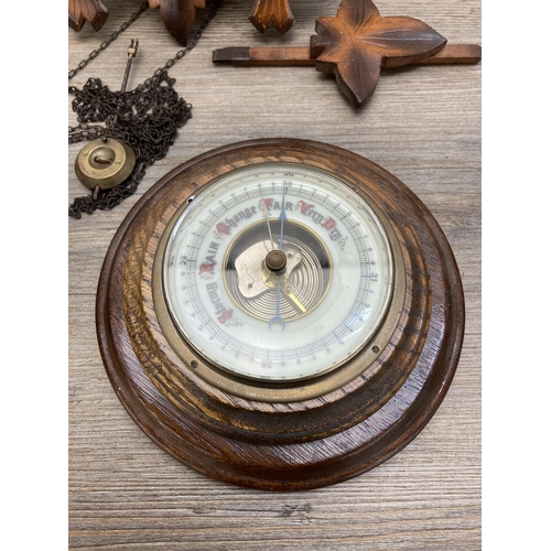 635 - Two items, vintage cuckoo clock with weights and oak cased aneroid barometer