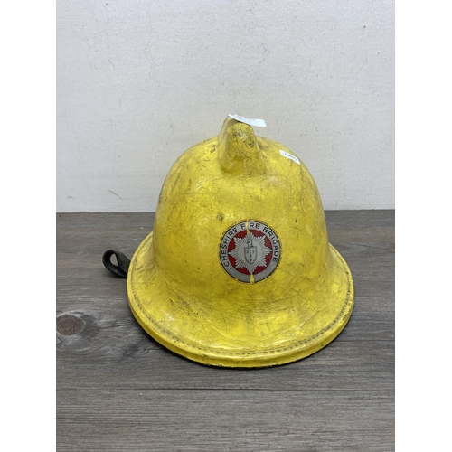 640A - A Cheshire Fire Brigade firefighters helmet, dated 1988