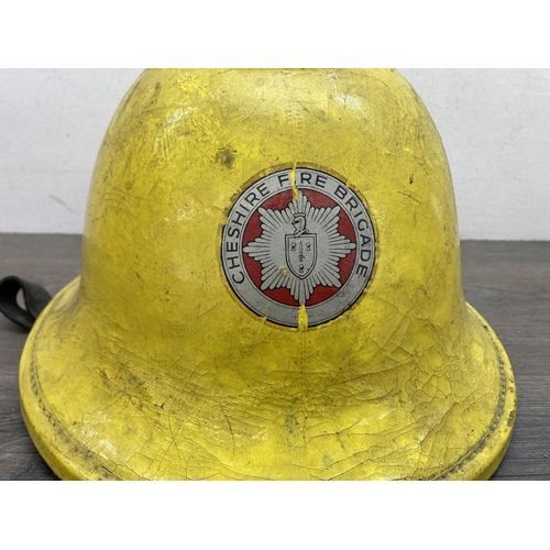 640A - A Cheshire Fire Brigade firefighters helmet, dated 1988