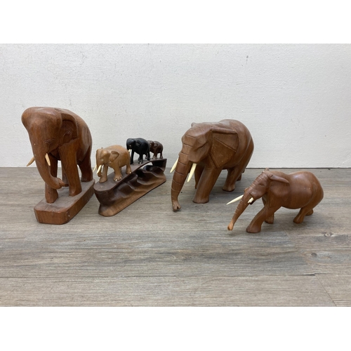 641 - Eight items to include three carved teak elephant figurines, pair of 1930s oak and chrome plated can... 