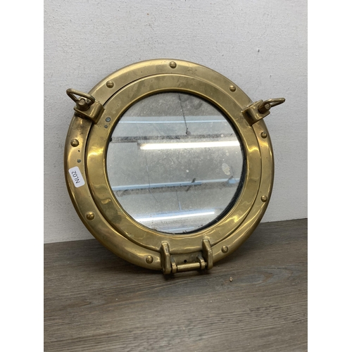 647A - Three vintage nautical style items, one brass porthole mirror - approx. 30.5cm diameter and two Pasc... 