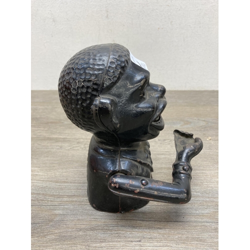 648B - A mid 20th century cast aluminium novelty money bank