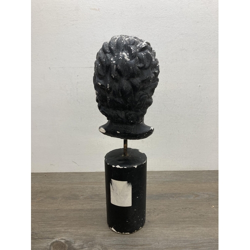 649B - A 19th century style black painted chalkware bust on wooden base - approx. 41cm high