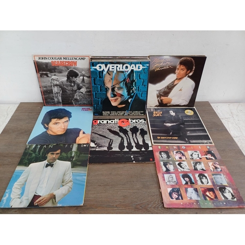 724 - A collection of vinyl records to include Blondie, Chicago, Michael Jackson, John Cougar Mellencamp, ... 