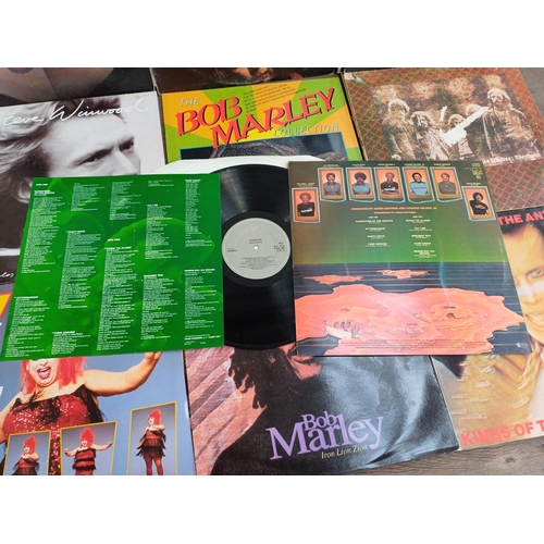 724 - A collection of vinyl records to include Blondie, Chicago, Michael Jackson, John Cougar Mellencamp, ... 