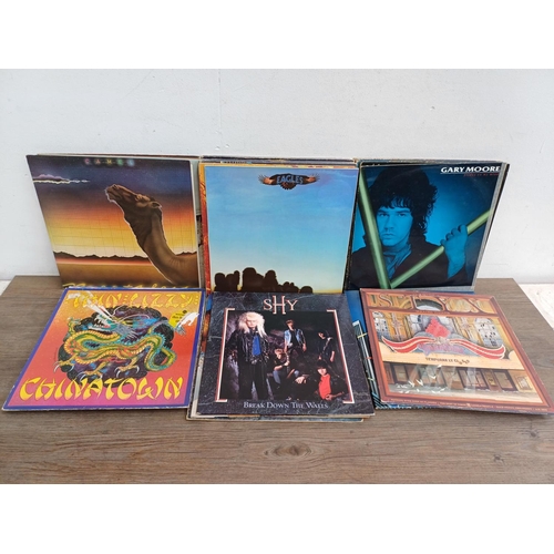 738 - A collection of rock vinyl records to include The Who, Barclay James Harvest, Styx (blue vinyl), Eag... 