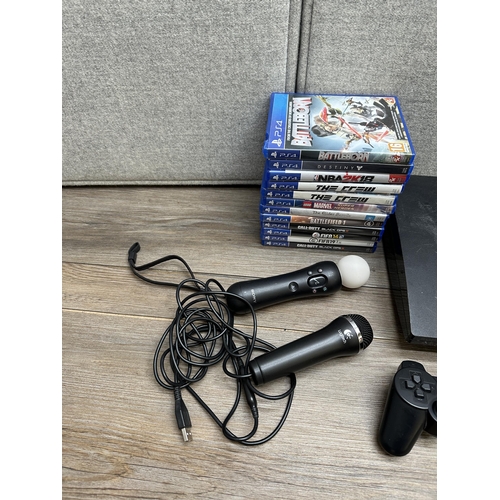 665 - A Sony PlayStation 3 CECH-2503B slim console with DualShock 3 controller, Move Controller and games