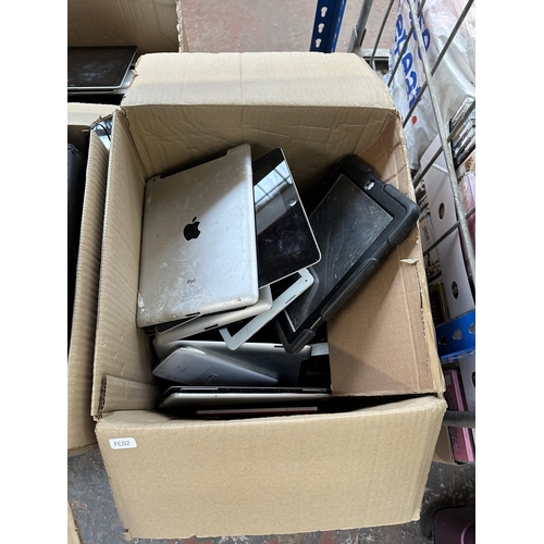 684 - Three boxes containing a large collection of broken tablets and cases to include Apple, Samsung, Kob... 