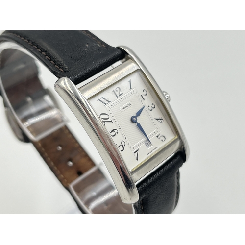 2235 - A boxed Coach W502B stainless steel quartz wristwatch with leather strap, service guide and warranty... 