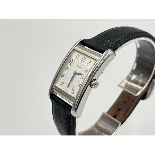 2235 - A boxed Coach W502B stainless steel quartz wristwatch with leather strap, service guide and warranty... 