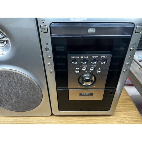 796 - A Sanyo DC-MM5000 micro stereo system comprising cassette player, CD player, receiver and a pair of ... 