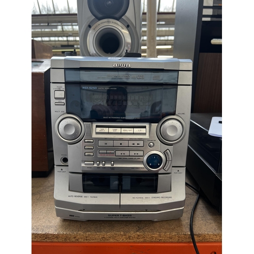 801 - An Aiwa CX-NSZ50K stereo system comprising three disc changer CD player, twin cassette and receiver ... 