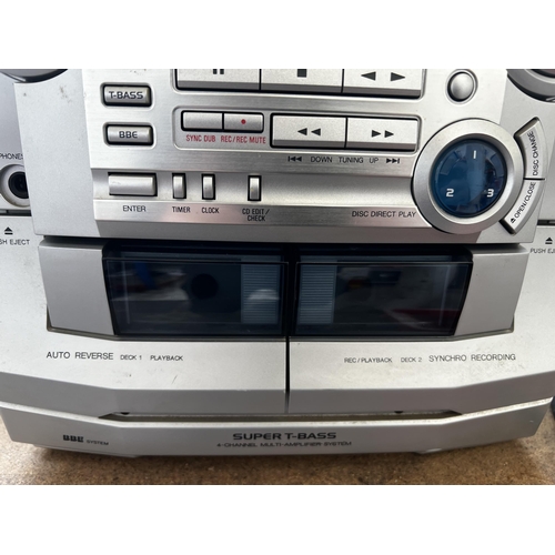 801 - An Aiwa CX-NSZ50K stereo system comprising three disc changer CD player, twin cassette and receiver ... 