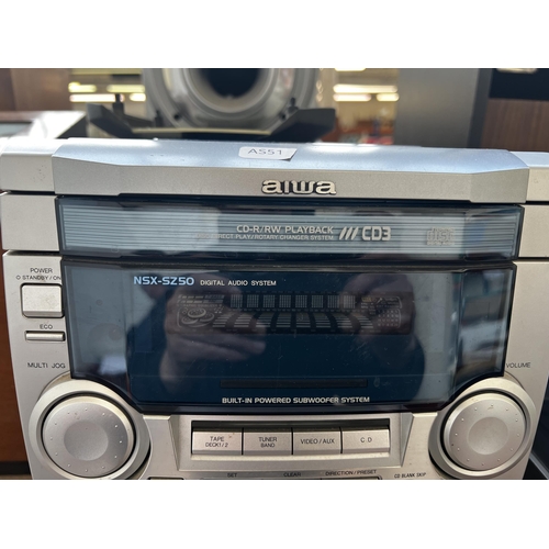 801 - An Aiwa CX-NSZ50K stereo system comprising three disc changer CD player, twin cassette and receiver ... 