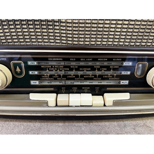 811 - A late 1950s Bush VHF71 seven valve table top radio with Bakelite casing