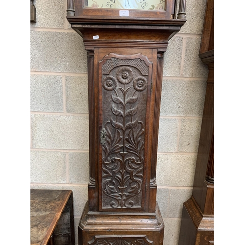 10 - A Georgian carved oak cased grandfather clock with hand painted enamel face, pendulum and weights - ... 