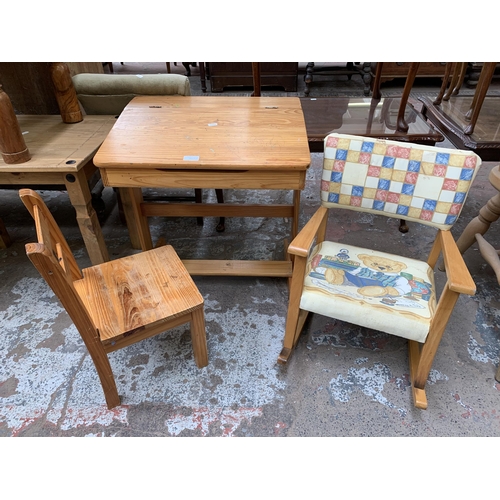 101 - Three pieces of child's furniture, one pine desk, one pine chair and one beech and fabric upholstere... 