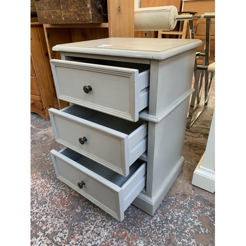 120 - A modern grey painted bedside chest of drawers - approx. 62cm high x 45cm wide x 34 cm deep