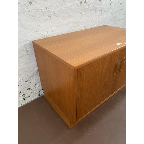 127 - A mid 20th century G Plan teak two door cabinet - approx. 54cm high x 82cm wide x 46cm deep