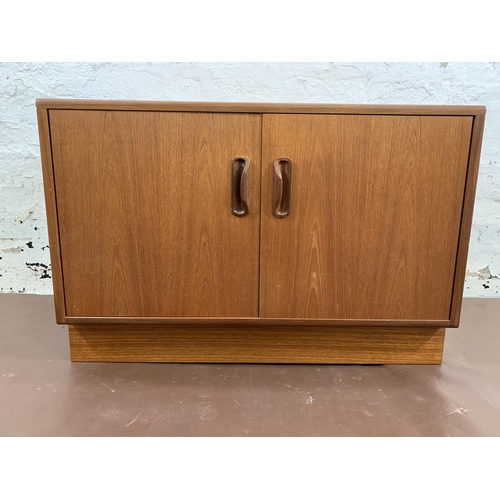 128 - A mid 20th century G Plan teak two door cabinet - approx. 54cm high x 82cm wide x 46cm deep