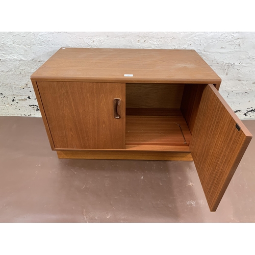 128 - A mid 20th century G Plan teak two door cabinet - approx. 54cm high x 82cm wide x 46cm deep