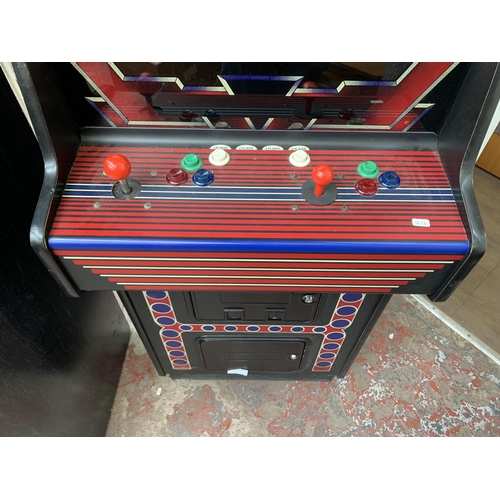 130 - A Super Video arcade machine, serial no. 23205 - approx. 183cm high x 65cm wide x 83cm deep