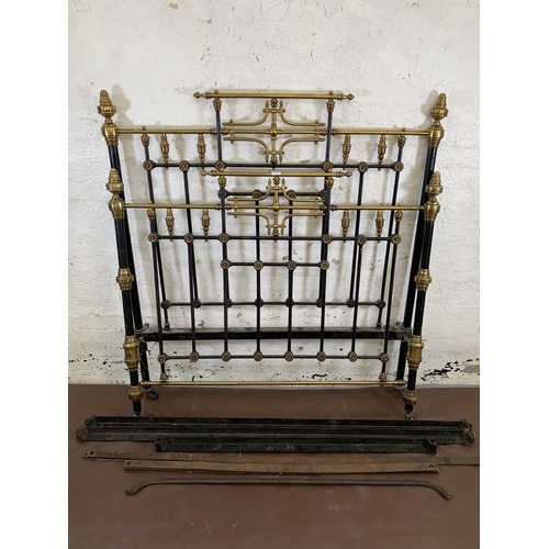 133 - A Victorian brass and cast iron double bed frame - approx. 138cm wide x 150cm high