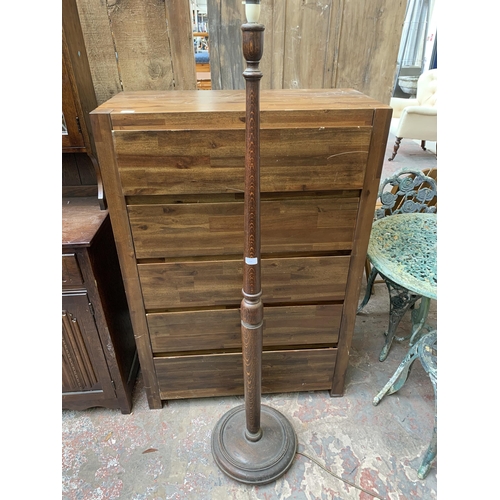 134 - A mid 20th century oak standard lamp with circular base - approx. 160cm high