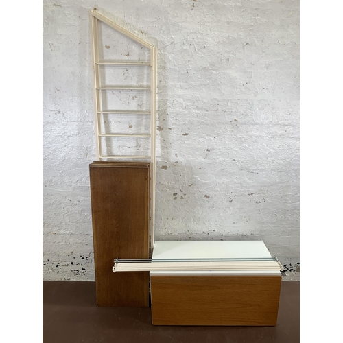 14 - A mid 20th century teak and white painted wall system