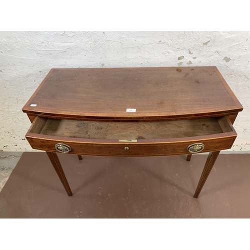 141 - An early 19th century inlaid mahogany bow fronted console table on tapering supports - approx. 75cm ... 