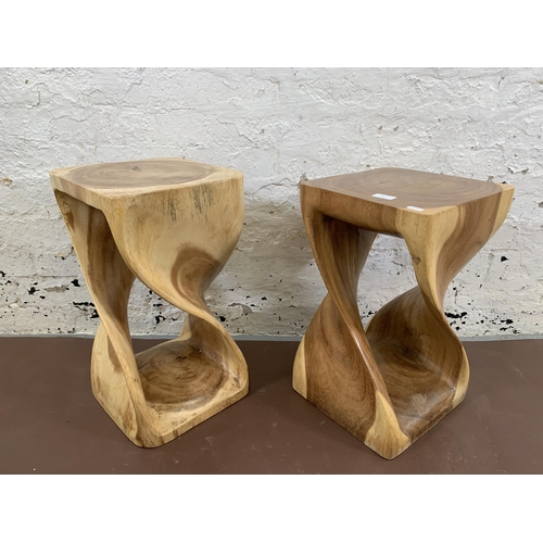 147 - A pair of Myakka Surin Infinity hand carved natural solid wood side tables - approx. 50cm high x 29c... 