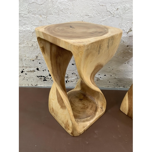 147 - A pair of Myakka Surin Infinity hand carved natural solid wood side tables - approx. 50cm high x 29c... 