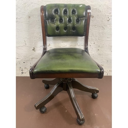 159 - A mahogany and green leather Chesterfield swivel desk chair