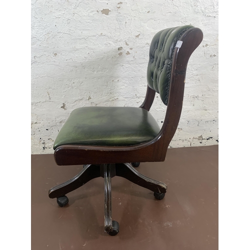 159 - A mahogany and green leather Chesterfield swivel desk chair