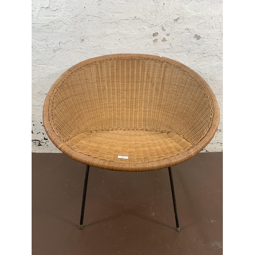 164 - A mid 20th century wicker satellite chair on black metal supports - approx. 69cm high x 76cm wide x ... 