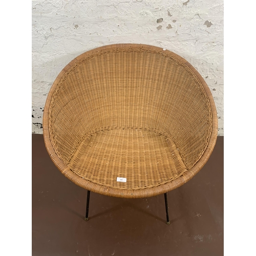 164 - A mid 20th century wicker satellite chair on black metal supports - approx. 69cm high x 76cm wide x ... 
