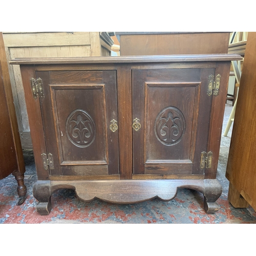 170 - An Art Nouveau carved mahogany two door cabinet - approx. 63cm high x 76cm wide x 35cm deep