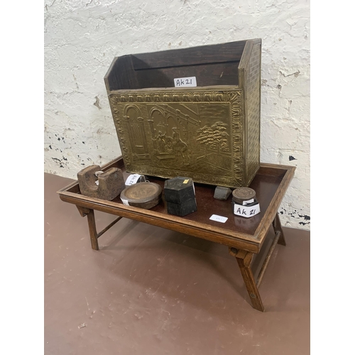 171 - Three items, one embossed brass magazine rack, one oak tray on stand and one box containing a collec... 