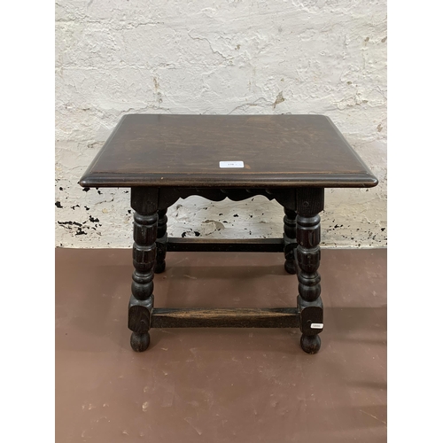 178 - Three pieces of furniture, one 17th century style ebonised oak joint side table, one elm and rush se... 