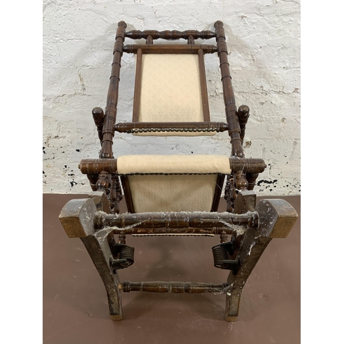 183 - An early 20th century American turned beech and fabric upholstered child's rocking chair - approx. 7... 