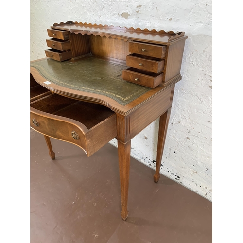 187 - A Burton Reproductions Limited mahogany and green leather writing desk on tapering supports - approx... 