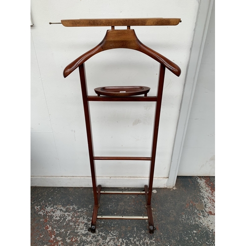 189 - Two pieces of furniture, one beech valet stand - approx. 110cm high and one metal and grey plastic f... 