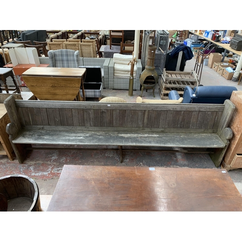 191 - A Victorian pitch pine church pew - approx. 101cm high x 308cm wide x 40cm deep