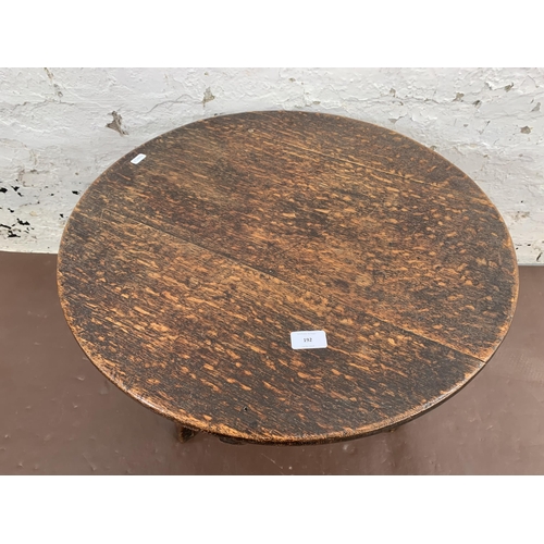 192 - A Georgian oak circular tripod occasional table - approx. 46cm high x 60cm diameter