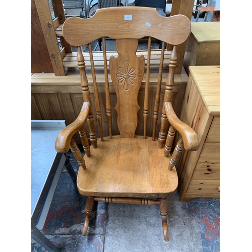 195 - A Victorian style beech rocking chair