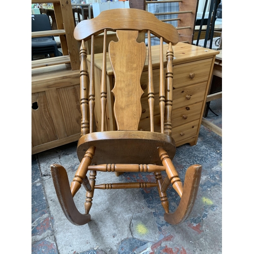 195 - A Victorian style beech rocking chair